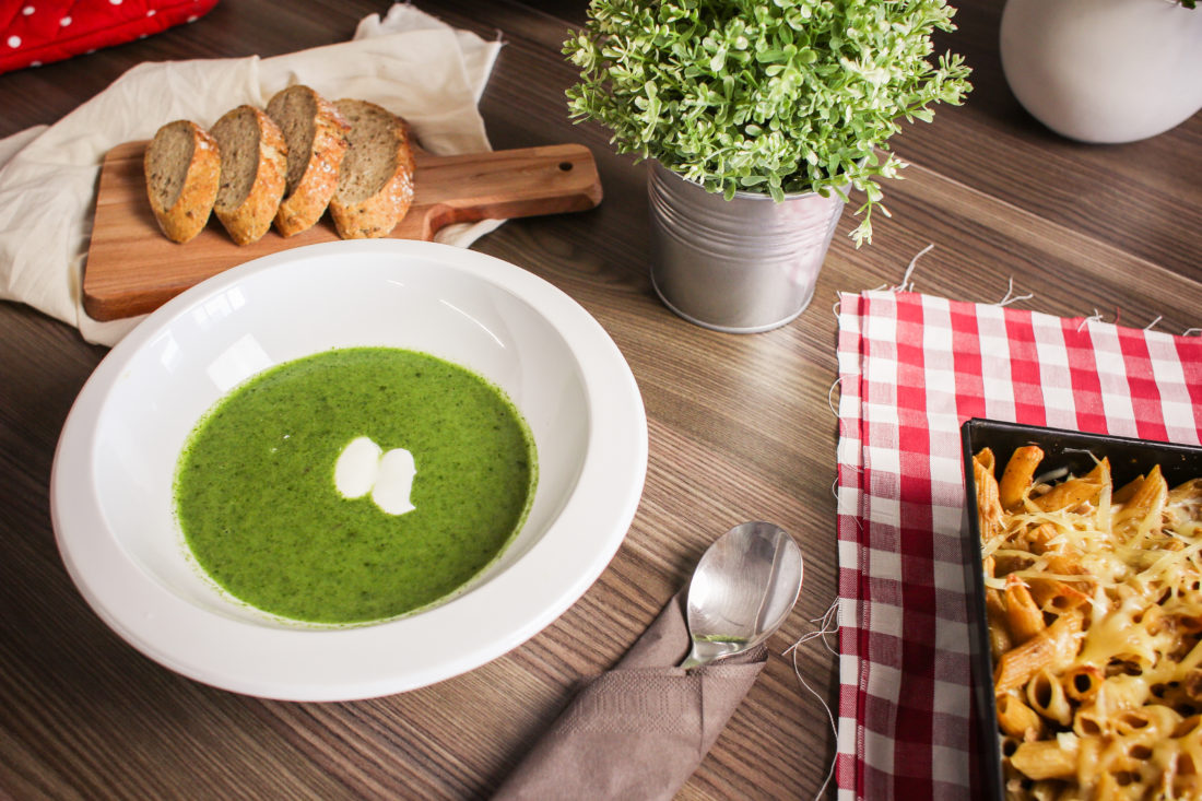 Bowl of spinach soup with bread