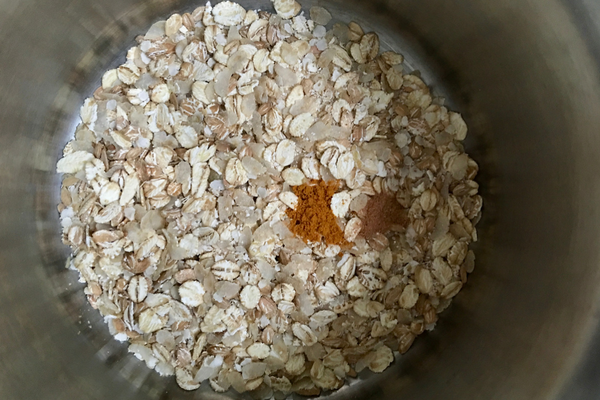 Raw ingredients for porridge in the pot - grains and spices