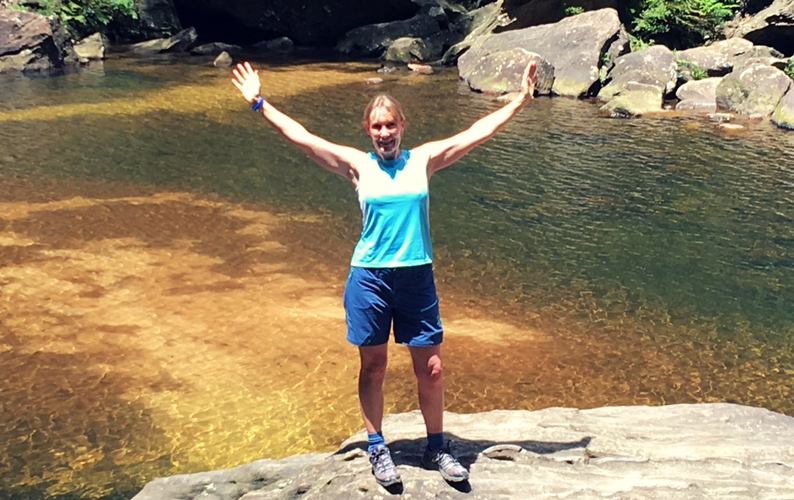 Sallyanne standing on a rock below Wentworth Falls Blue Mountains National Park