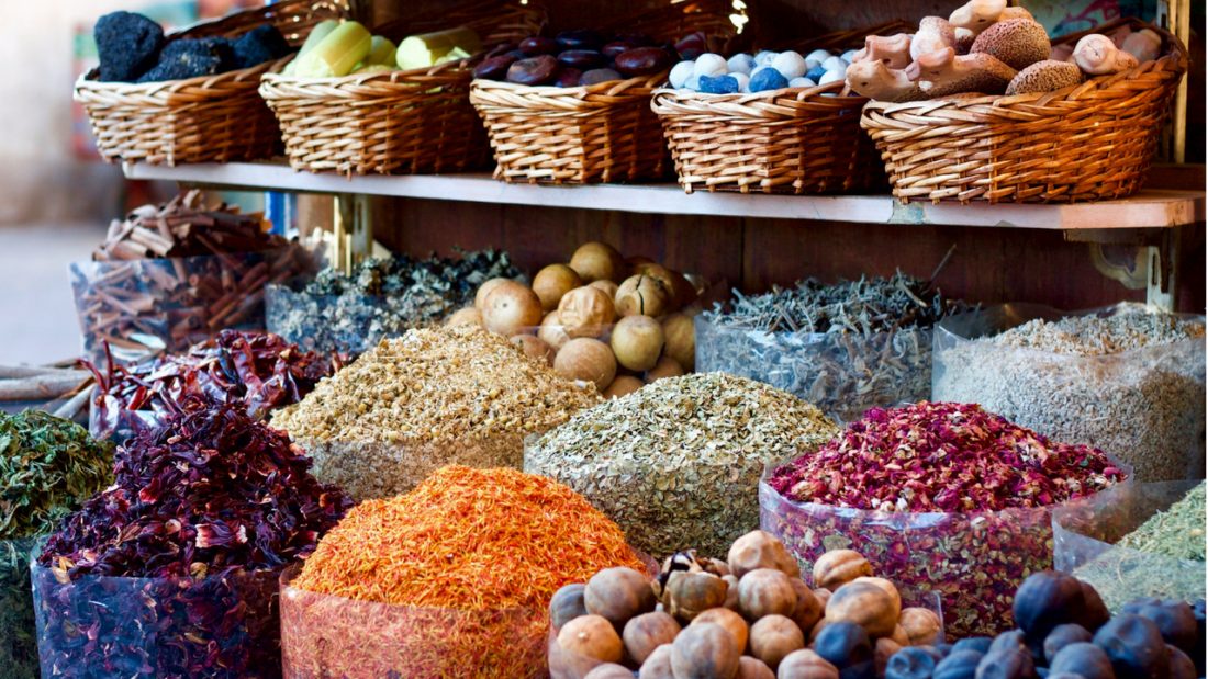 Bulk herbs and spices displayed in cane baskets and bags