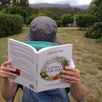Reading Eating for You in a country garden