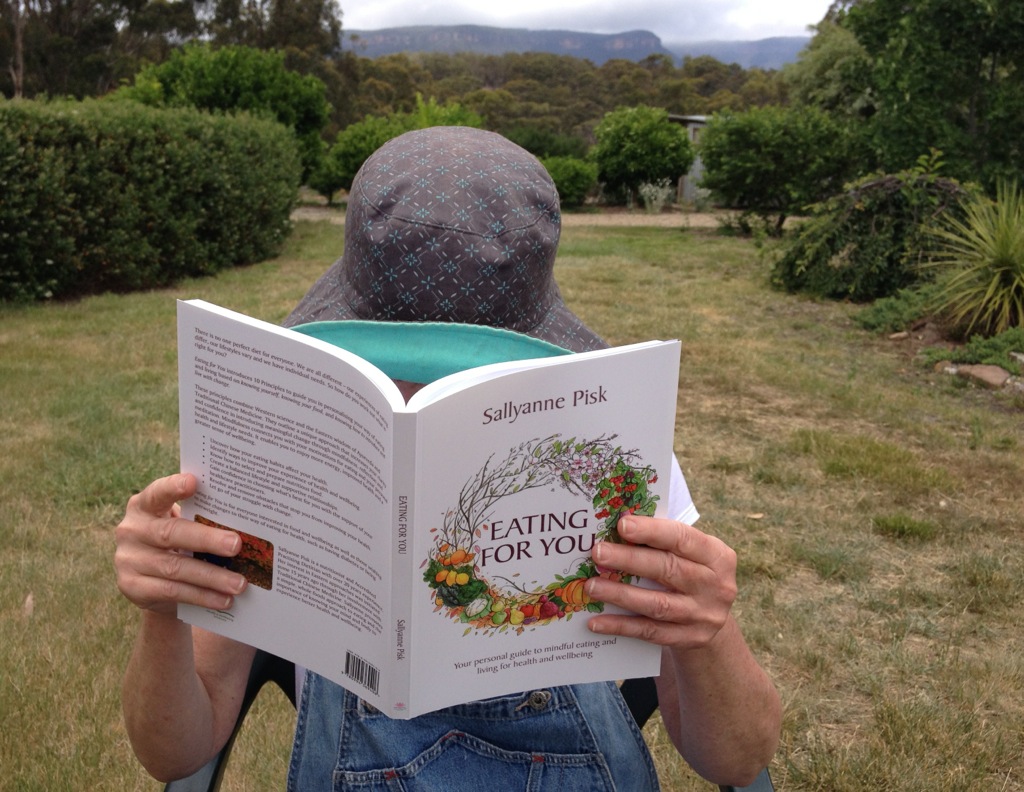 Reading Eating for You in a country garden