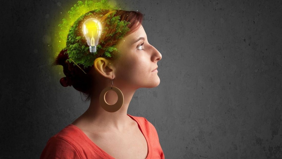 Woman with light bulb going off in her brain