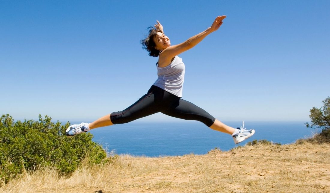Lady leaping with health and vitality